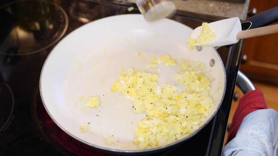 Adding red pepper flakes to pan