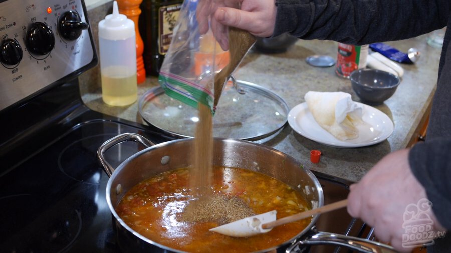 Water is poured into pan from measuring cup