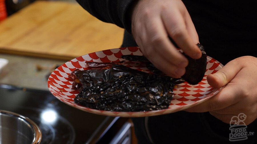 Turning over plate of dried chilies after 45 secs in microwave (New Mexico Chiles, Ancho, Arbol)