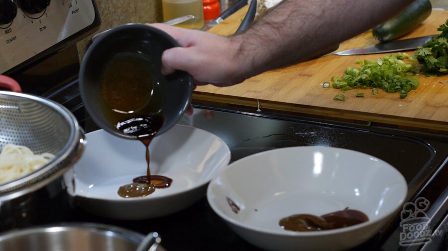 2 bowls with sesame paste, soy sauce, sugar, and chinkiang vinegar