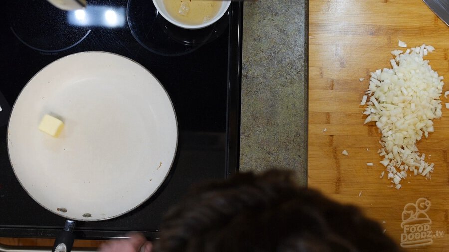 adding butter to a hot pan