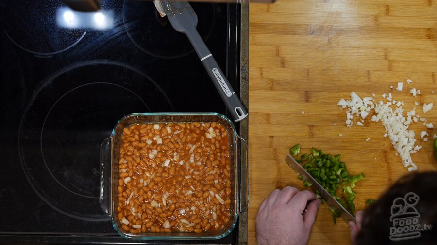 Chopped bell peppers added to the baked beans