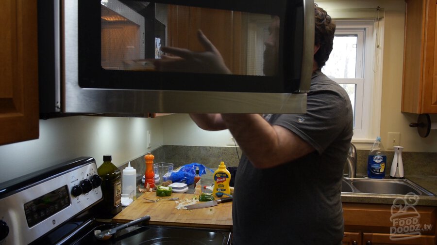 Baked bean mixture being added to the microwave