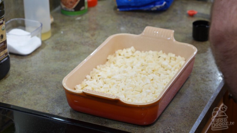 Frozen hashbrowns added to baking dish