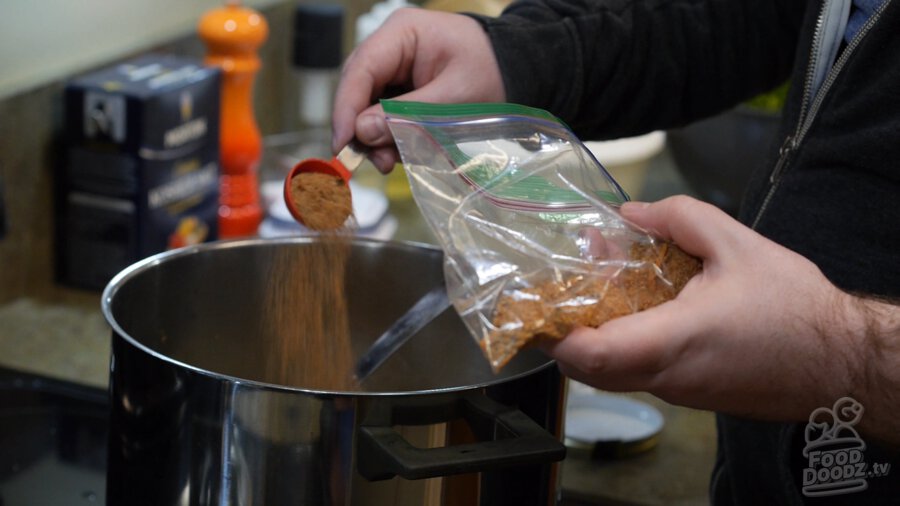 cajun seasoning added to pot