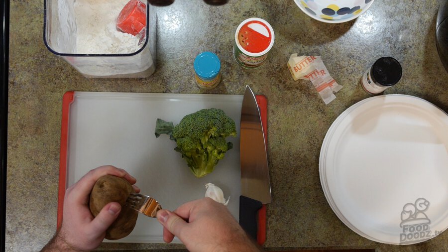 Poking potato with a fork