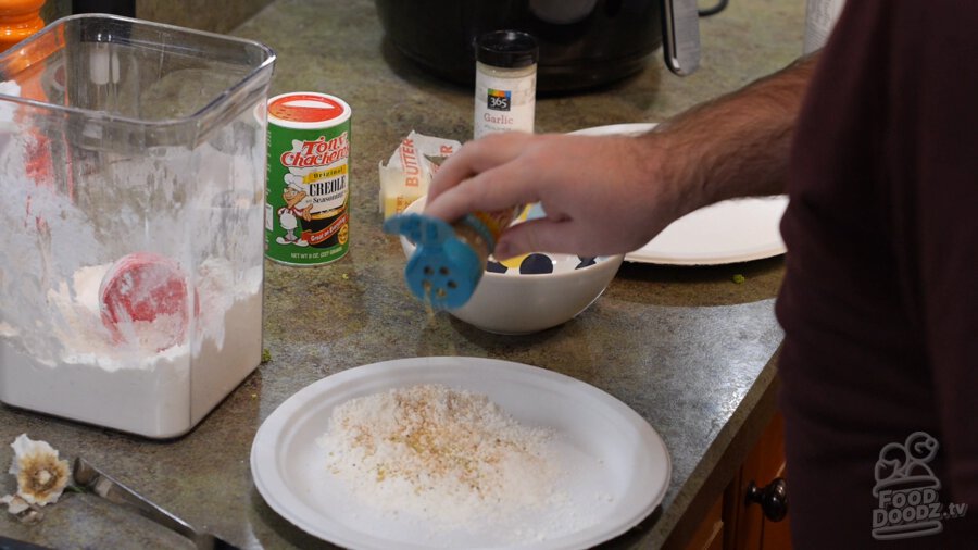 Flour in a plate with seasoning added