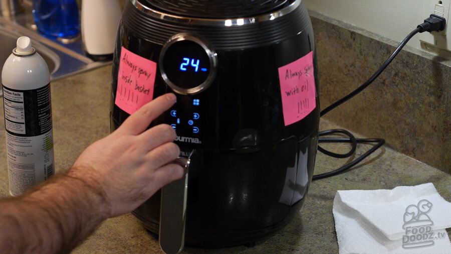 Setting the air fryer timer for 24 minutes