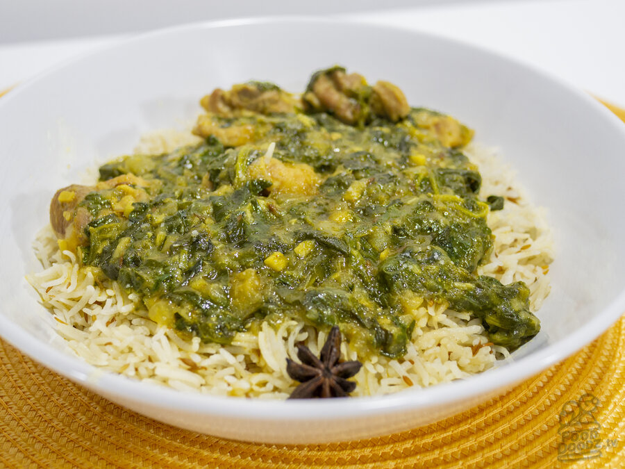 A plate of delicious chicken saag and cumin rice