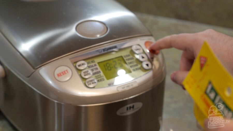 Turning the rice cooker on