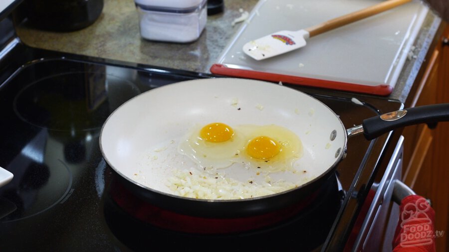 Adding eggs to pan