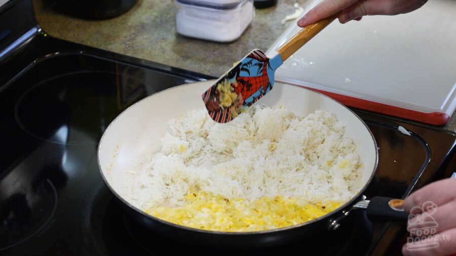 Adding rice to pan