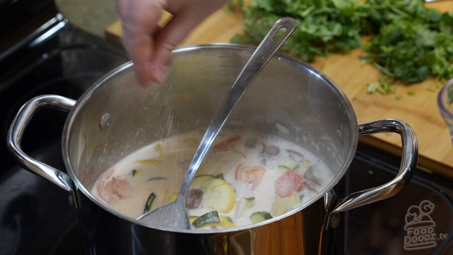 Salt being sprinkled into the pot