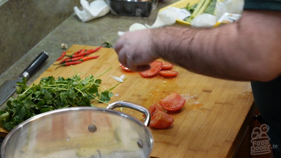 Cutting tomatoes into wedges