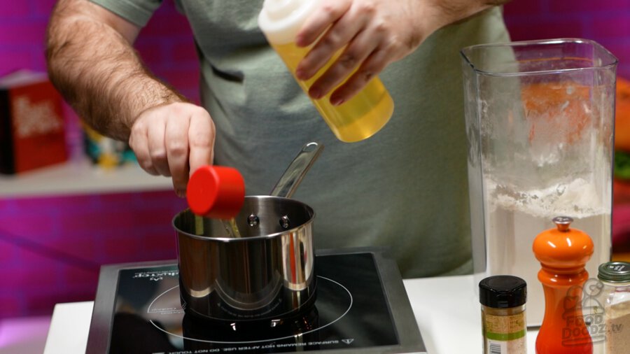 Adding vegetable oil to pot for the roux