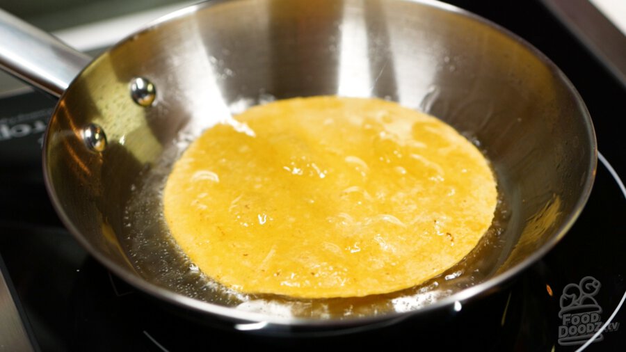 A tortilla that has been properly fried on one side