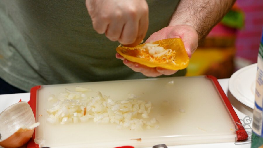 Adding onion on top of the cheese.