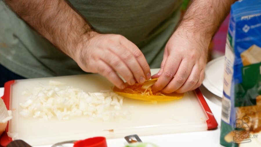 Rolling and tucking the filling into the tortilla