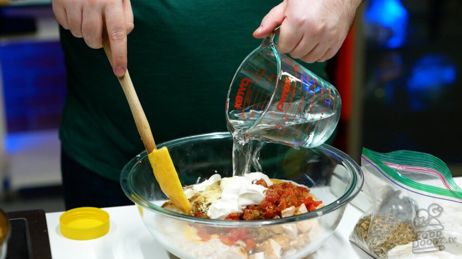 Chicken bouillon and water being added