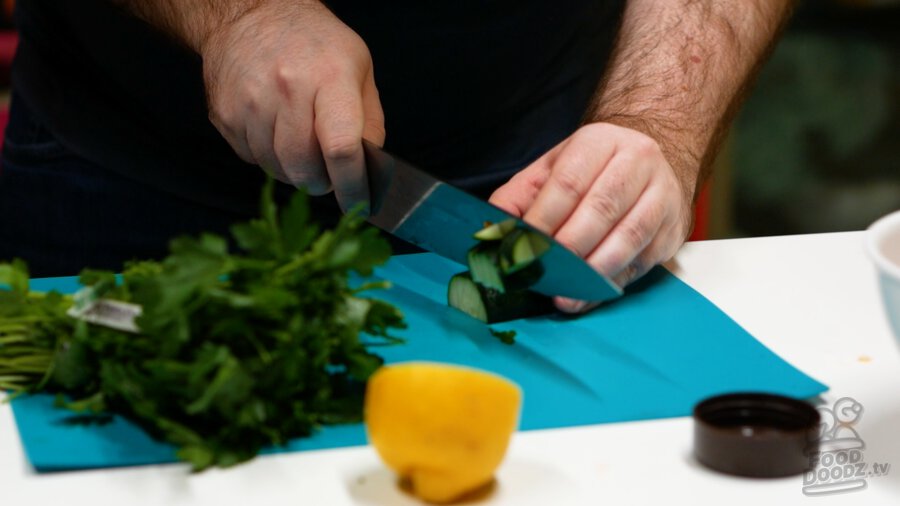 Chopping up cucumber