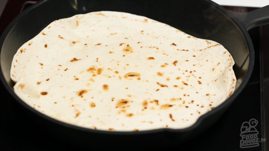 Warming up a tortilla in a skillet