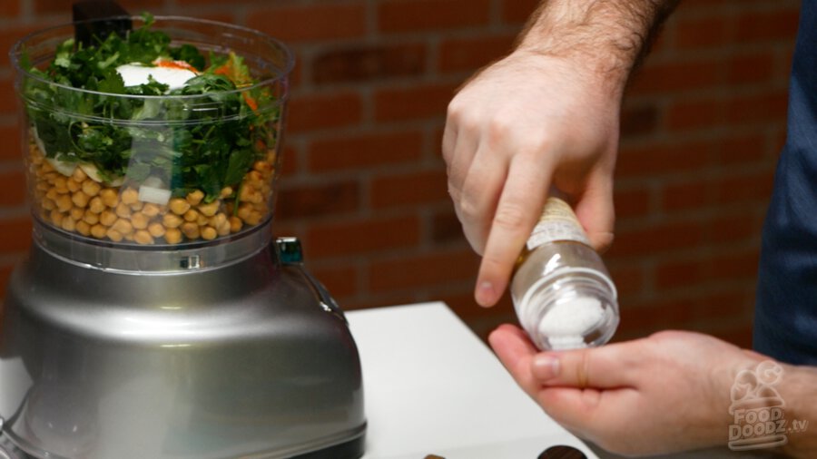 Measuring out salt for food processor