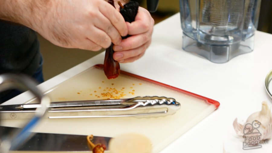 Removing seeds from a gaujillo chile