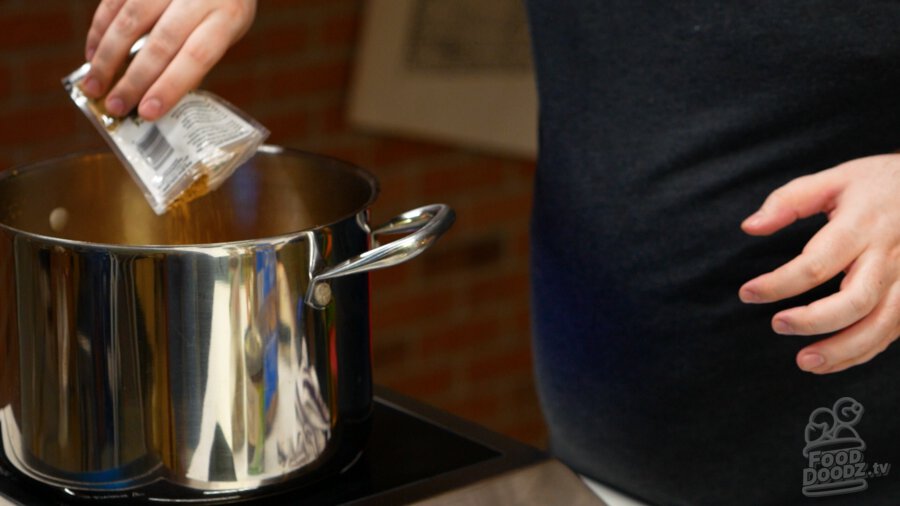 Adding cumin to pot