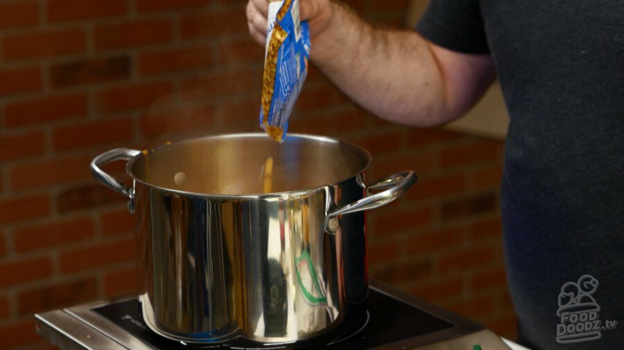 Adding corn to pot