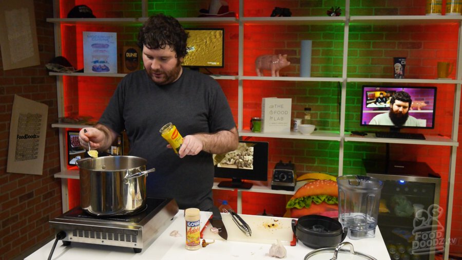 Adding chicken bouillon powder to pot