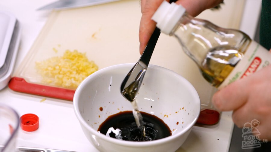 Adding vinegar to bowl