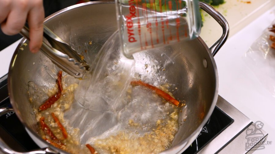 Adding water to the pan