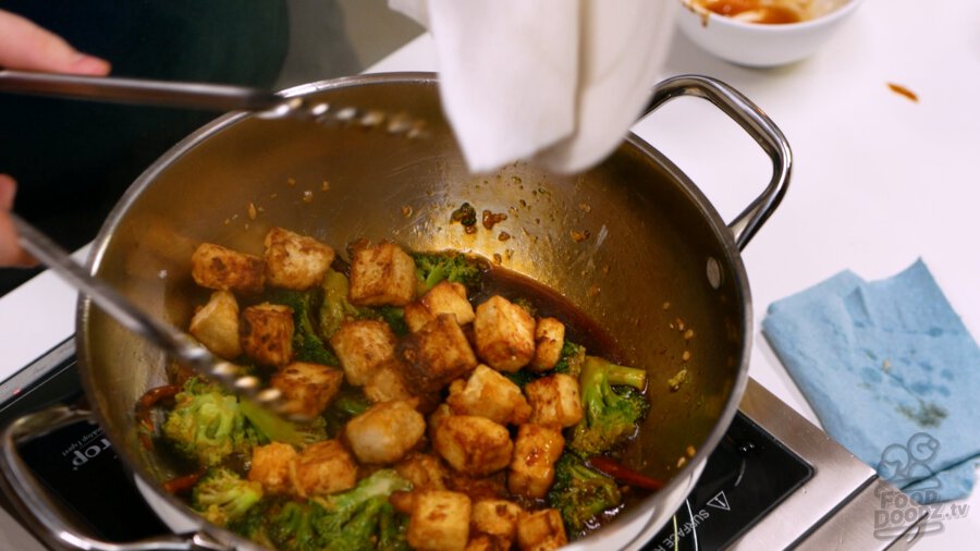 Adding the tofu to the pan