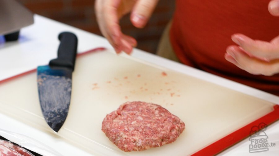 Making a sausage burger patty