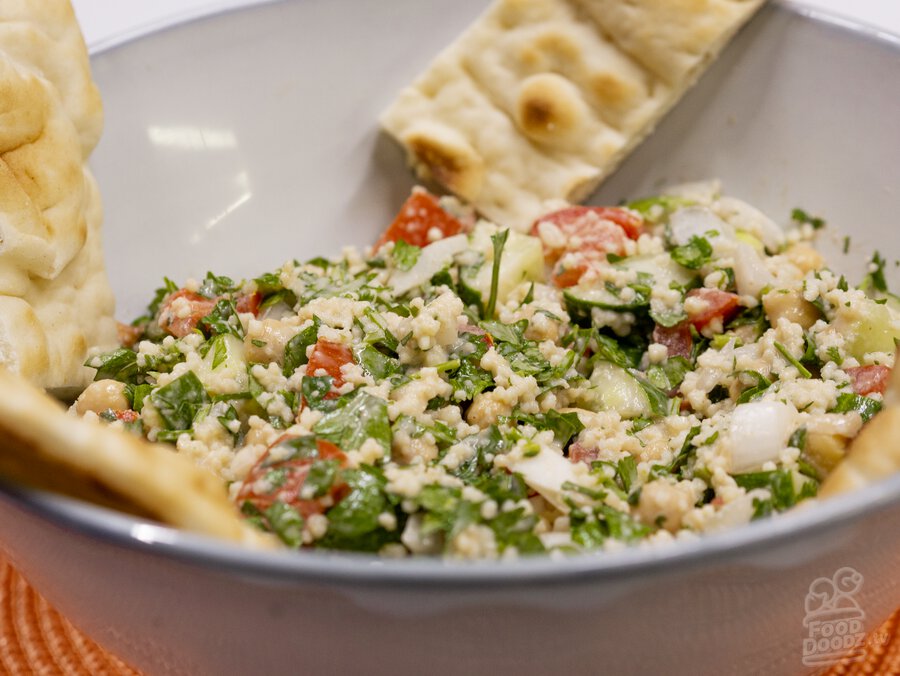 A big bowl of delicious falafel salad with tahini dressing.
