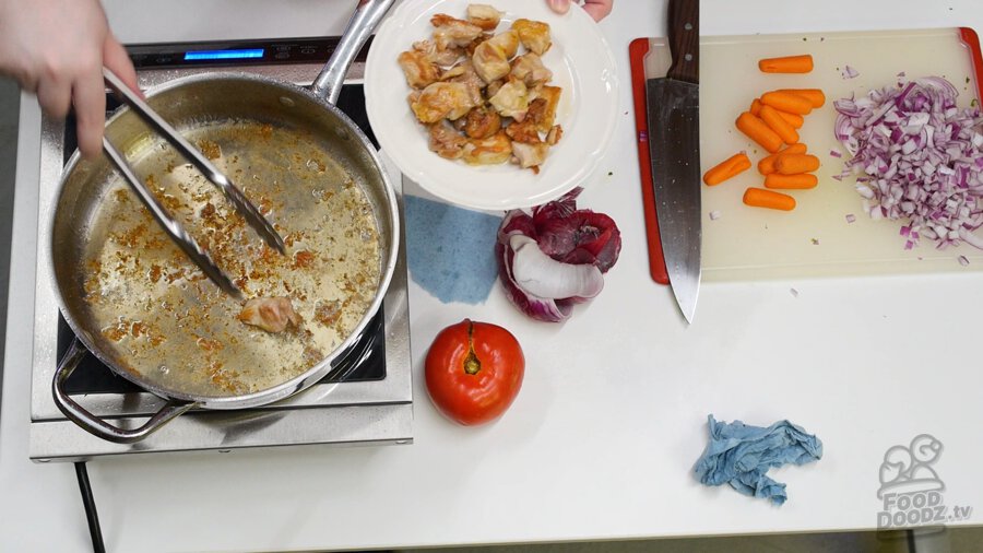 Removing well browned chicken pieces