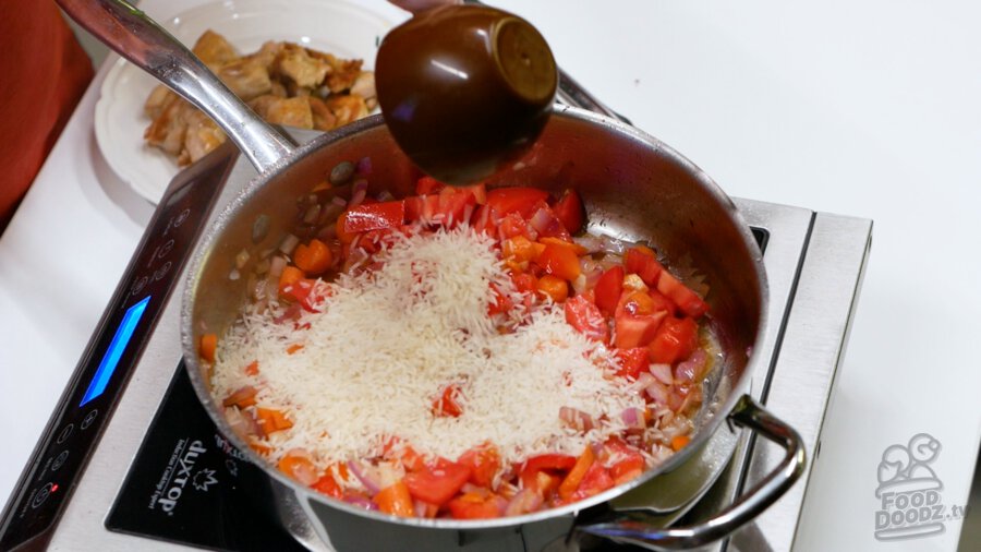 Adding rice to pan