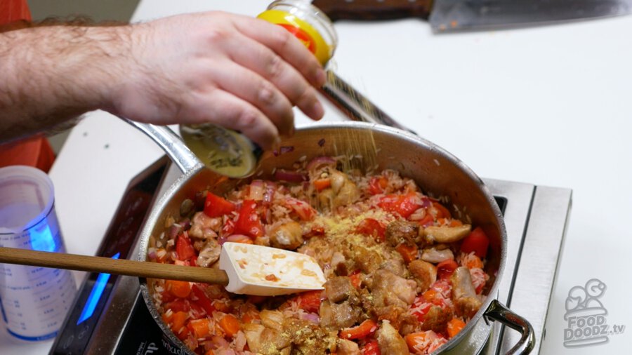 Adding chicken bouillon powder to the pan