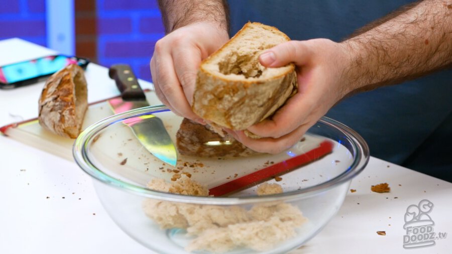 Ripping up bread into chunks