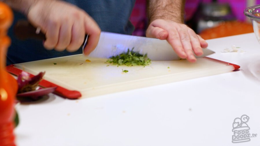 Roughly chopping oregano