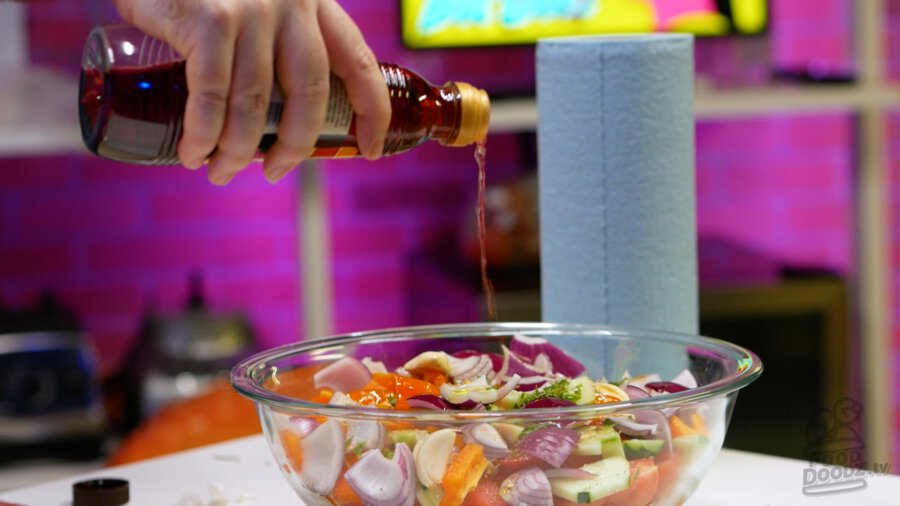 Adding red wine vinegar to bowl