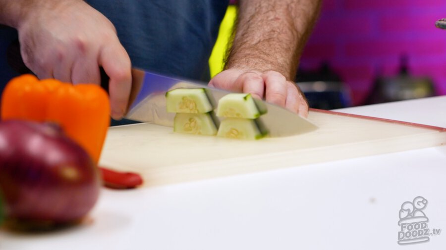 cutting up the cucumber