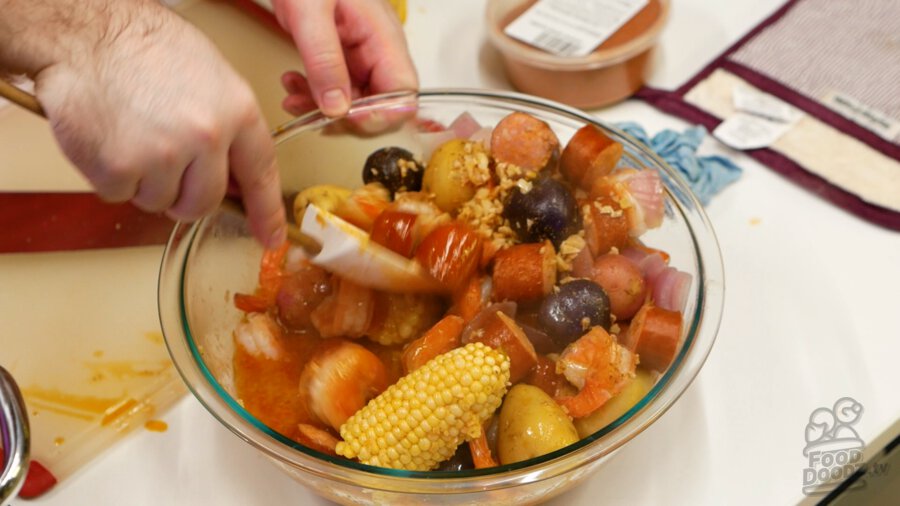 Mixing sauce into ingredients