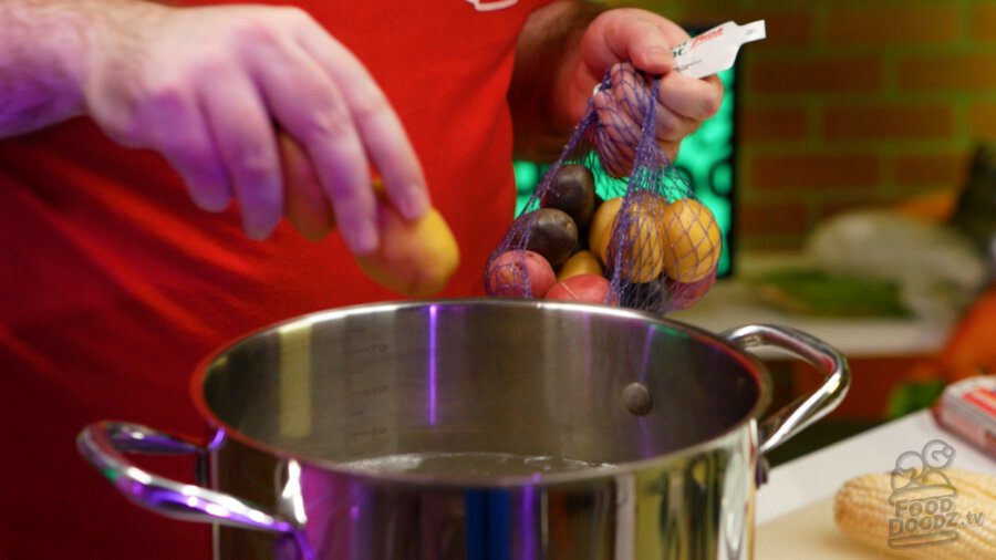 Adding potatoes to pot