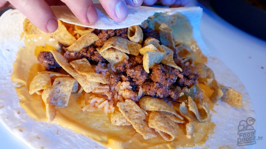 Rolling our own homemade version of the now discontinued Beefy Fritos Burrito from Taco Bell.