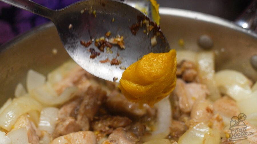 adding chicken bouillon paste to pan