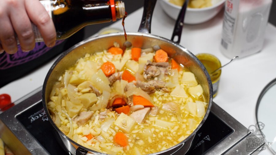 adding soy sauce to pan