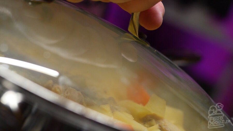 putting lid on boiling pan