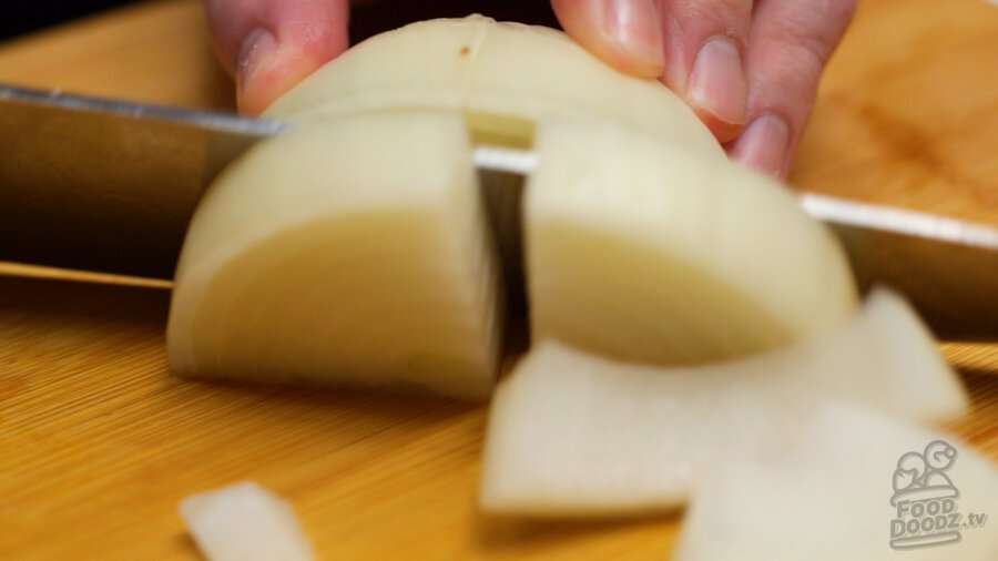 Slicing onion into large slices