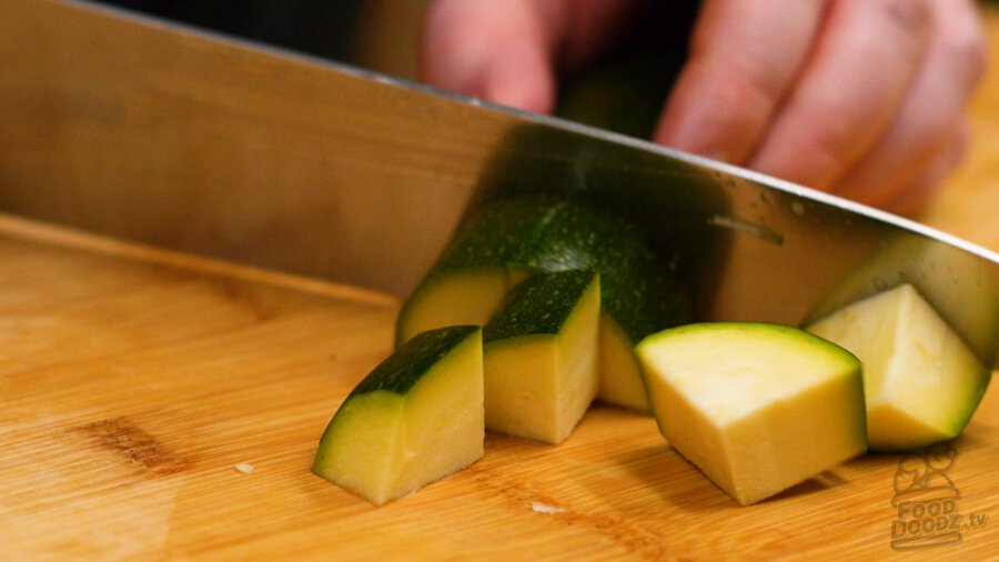 cutting up zucchini into half moons